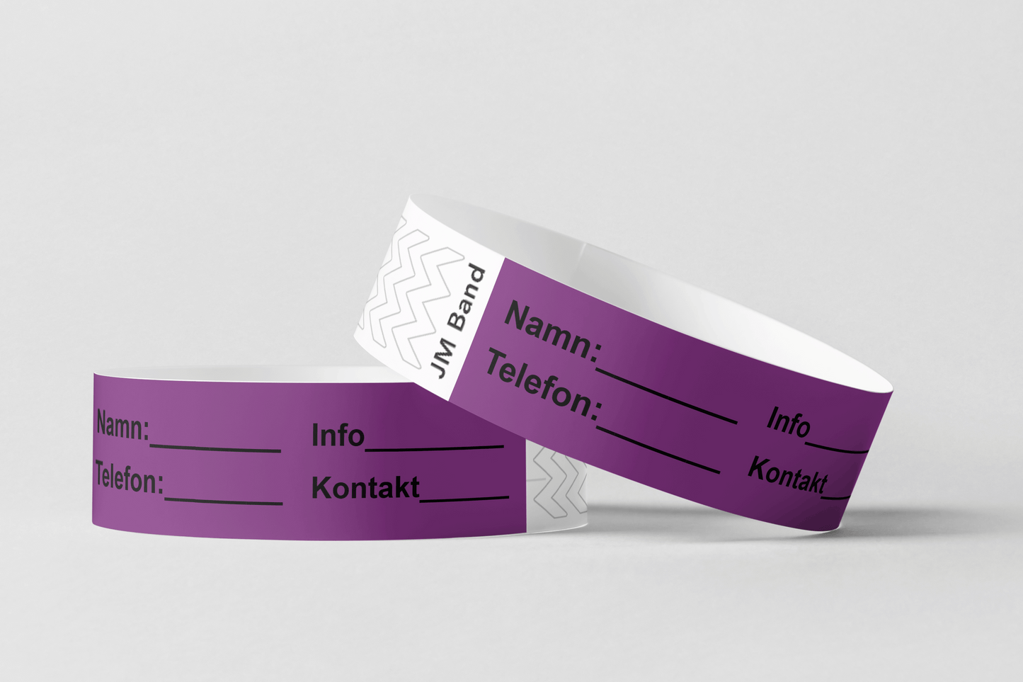 Två Papper ID-armband på vit bakgrund