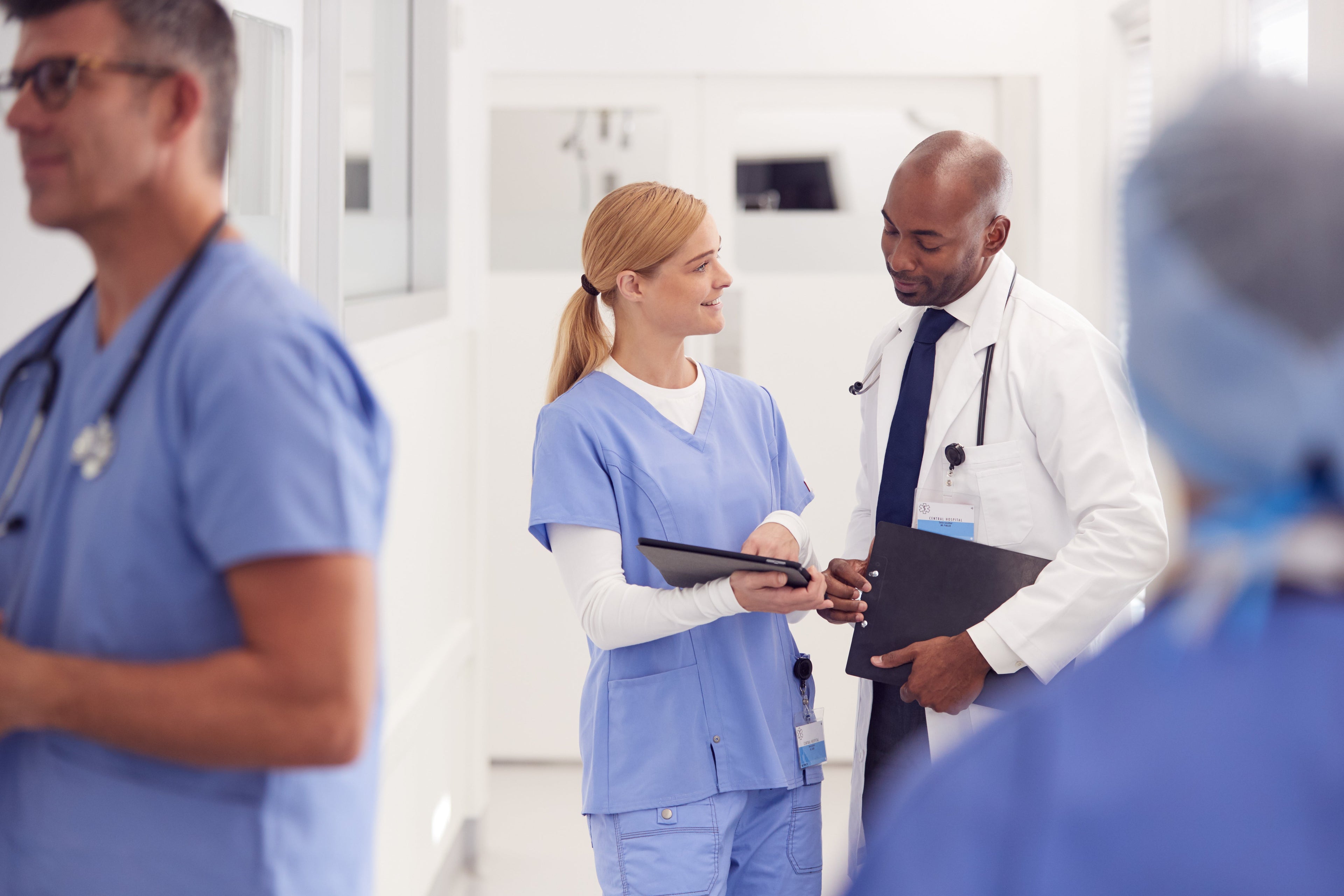 doctor in white coat and nurse