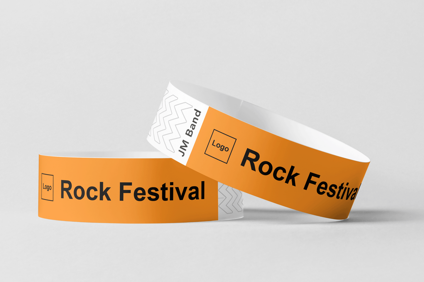 Ett foto av två Pappersarmband med Tryck från JM Band®. Köp Pappersarmband i Orange här.