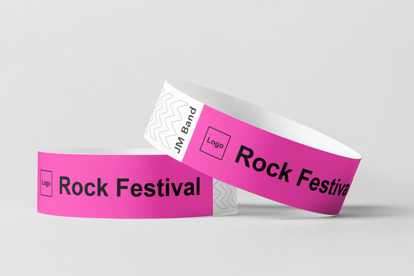Ett foto av två Pappersarmband med Tryck från JM Band®. Köp Pappersarmband i rosa här.