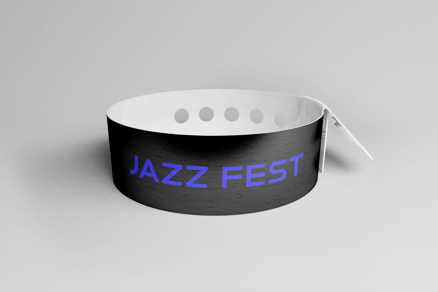 Ett rosa plastarmband L-print Design själv armband med ordet jazzfest på.