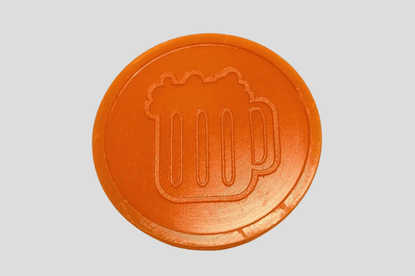Ett foto av Präglade Plastpolletter i Lager från JM Band®. Köp Polletter i Öl Orange här.