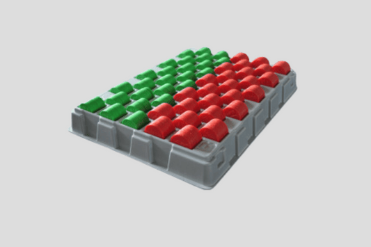 En tålig plastbricka med gröna och röda rutor på Polletter räkna bricka I lager.