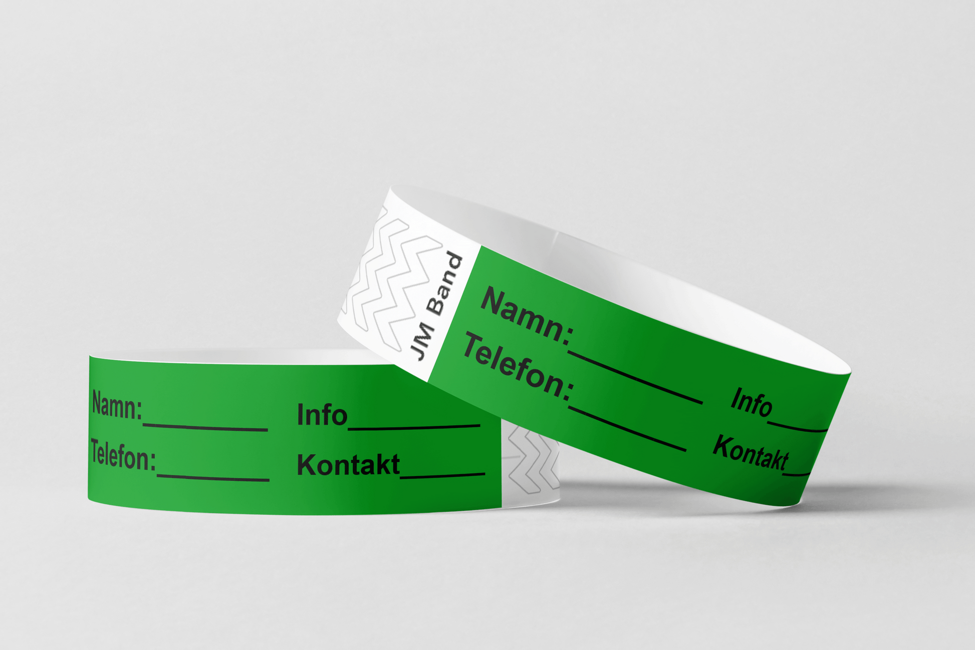 Två Papper ID-armband på vit bakgrund