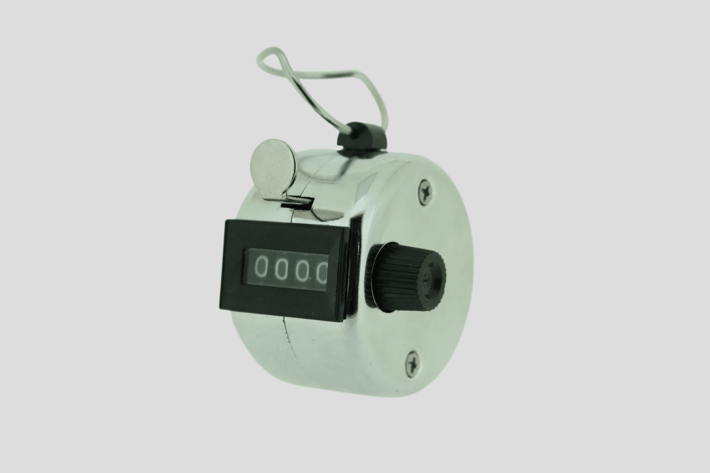 En liten elektronisk Entréräknare- analog på vit bakgrund.