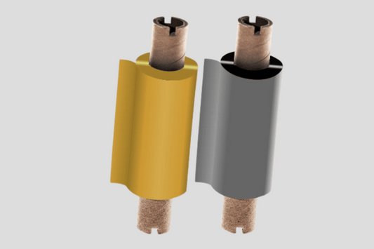 Ett par gula och bruna rör på en grå bakgrund, med Folier för Termisk överföring FM för precision och förbättrad färgkraft.