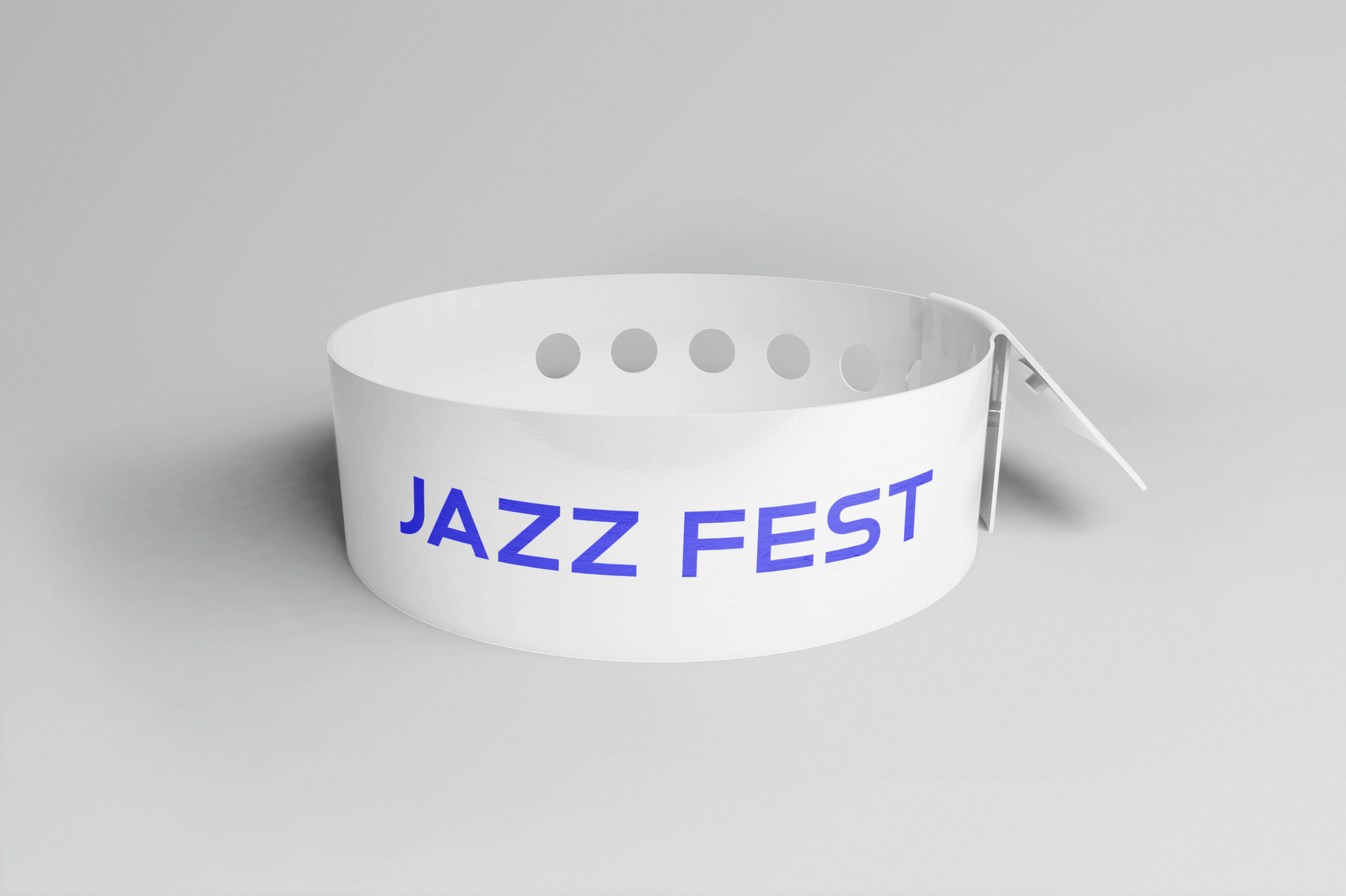 Ett rosa plastarmband L-print Design själv armband med ordet jazzfest på.
