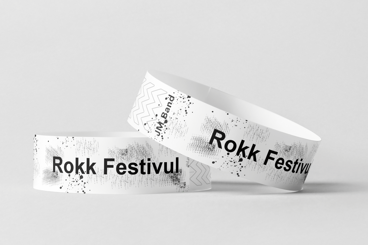 Två Papperarmband Specialerbjudande-Mysteriebox med ordet rok festival på.
